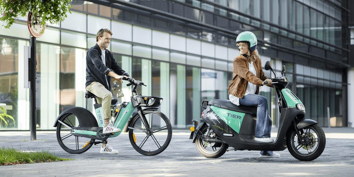 TIER Mobility e-scooters lined up on a city street